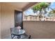 Relaxing balcony featuring a table and chairs, perfect for enjoying the outdoor view at 2451 N Rainbow Blvd # 1066, Las Vegas, NV 89108