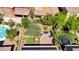 Aerial shot of home with an outdoor pool, patio, play area and greenery, perfect for entertaining at 2544 Sable Ridge St, Henderson, NV 89044