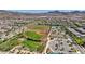 A community aerial view highlighting baseball fields, green spaces and a picturesque mountain backdrop at 2544 Sable Ridge St, Henderson, NV 89044