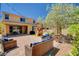 Charming backyard features a covered patio, playground, lush landscaping, and inviting seating at 2544 Sable Ridge St, Henderson, NV 89044