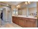 Bathroom with dual vanity, tile floor and lots of sunlight at 2544 Sable Ridge St, Henderson, NV 89044