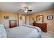 Well-lit bedroom featuring carpeted floors, ceiling fan, neutral walls, and ample natural light at 2544 Sable Ridge St, Henderson, NV 89044