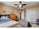 A bedroom featuring carpeted floors and a ceiling fan at 2544 Sable Ridge St, Henderson, NV 89044