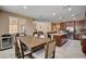 A cozy dining area connects to the kitchen and living room in an open-concept layout at 2544 Sable Ridge St, Henderson, NV 89044