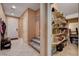 Hallway features a pantry, stairs, and tile floors at 2544 Sable Ridge St, Henderson, NV 89044