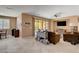 Comfortable living area with tile flooring, fan, backyard access, neutral wall color, and stylish decor at 2544 Sable Ridge St, Henderson, NV 89044