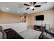 Upstairs living room with neutral walls, carpeted floors, ceiling fan, and television at 2544 Sable Ridge St, Henderson, NV 89044