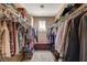 Walk-in closet with built-in storage for shoes and clothing at 2544 Sable Ridge St, Henderson, NV 89044