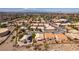 High angle view highlights community homes with desert landscape and a street view at 2587 Grizzly Park Ct, Henderson, NV 89052
