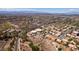 Community aerial view featuring desert landscaping, paved streets, and scenic mountain views at 2587 Grizzly Park Ct, Henderson, NV 89052