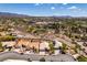 An elevated perspective capturing the neighborhood, the lush greenway, and the residence nestled within the community at 2587 Grizzly Park Ct, Henderson, NV 89052