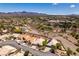 An aerial shot offering a glimpse of the home's location within a picturesque community with mountain views at 2587 Grizzly Park Ct, Henderson, NV 89052