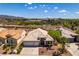 Spacious home boasts well-manicured landscaping and a neutral color palette, complemented by desert views at 2587 Grizzly Park Ct, Henderson, NV 89052