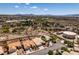 An aerial image featuring the surrounding suburban landscape with views of local infrastructure and mountain backdrop at 2587 Grizzly Park Ct, Henderson, NV 89052