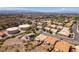 Scenic aerial captures neighborhood homes with well-manicured lawns and mature trees at 2587 Grizzly Park Ct, Henderson, NV 89052