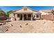 Charming home featuring a covered patio and low-maintenance desert landscaping in the private backyard at 2587 Grizzly Park Ct, Henderson, NV 89052