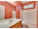 Clean bathroom featuring tile flooring, white cabinets, and a bath tub at 2587 Grizzly Park Ct, Henderson, NV 89052