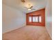 Spacious bedroom with a window seat, neutral carpet and ceiling fan for added comfort at 2587 Grizzly Park Ct, Henderson, NV 89052