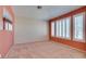 Bright bedroom featuring neutral carpet, fresh paint, and natural light at 2587 Grizzly Park Ct, Henderson, NV 89052