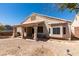 Exterior view of a home with a covered patio and desert landscaping at 2587 Grizzly Park Ct, Henderson, NV 89052