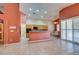 Open kitchen offers wood cabinets, tile floors, and modern appliances at 2587 Grizzly Park Ct, Henderson, NV 89052