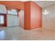 Spacious living room showcasing tile flooring, plantation shutters, and a chandelier at 2587 Grizzly Park Ct, Henderson, NV 89052
