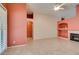 Spacious living room features tile flooring, fireplace, and neutral wall color at 2587 Grizzly Park Ct, Henderson, NV 89052