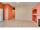 Open living room with tile flooring, fireplace, and sliding doors at 2587 Grizzly Park Ct, Henderson, NV 89052