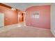 Spacious living room with tile flooring, neutral walls, and plenty of natural light at 2587 Grizzly Park Ct, Henderson, NV 89052