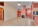Bright living room with a fireplace, tile floors, and open floorplan at 2587 Grizzly Park Ct, Henderson, NV 89052