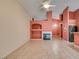 Bright living room boasts tile flooring, fireplace, and open floorplan to dining at 2587 Grizzly Park Ct, Henderson, NV 89052