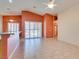 Open living area with tile flooring, ceiling fans, and view to the backyard at 2587 Grizzly Park Ct, Henderson, NV 89052