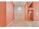 Bright living room with neutral walls, chandelier and tile flooring at 2587 Grizzly Park Ct, Henderson, NV 89052