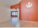 Open living room features tile flooring, shutters, and elegant lighting at 2587 Grizzly Park Ct, Henderson, NV 89052