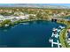 Aerial view of a lake community, showcasing waterfront properties, lush landscaping, and recreational facilities at 2736 Huber Heights Dr, Las Vegas, NV 89128