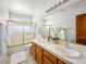 Bathroom featuring double sinks, a large mirror, and a separate tub with shower at 2736 Huber Heights Dr, Las Vegas, NV 89128