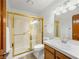 Bathroom with a glass enclosed shower, vanity with sink, and a toilet at 2736 Huber Heights Dr, Las Vegas, NV 89128