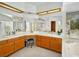 Spacious bathroom with double sinks, ample cabinet space, large mirrors, and a separate bathtub at 2736 Huber Heights Dr, Las Vegas, NV 89128