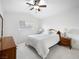 Bright bedroom with a ceiling fan, neutral carpet, and natural light from the window at 2736 Huber Heights Dr, Las Vegas, NV 89128