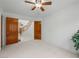 Spacious bedroom with open double doors leading to an open staircase at 2736 Huber Heights Dr, Las Vegas, NV 89128
