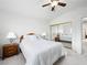 Cozy bedroom with mirrored closet doors, ceiling fan, and a comfortable bed with white linens at 2736 Huber Heights Dr, Las Vegas, NV 89128