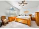 Primary bedroom featuring a large bed, side tables, and a window with an arch at 2736 Huber Heights Dr, Las Vegas, NV 89128