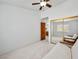 Spare bedroom with mirrored closet doors, carpet and a view into the kitchen area at 2736 Huber Heights Dr, Las Vegas, NV 89128