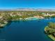 Serene lake community featuring mountain views, a large pool and manicured grounds at 2736 Huber Heights Dr, Las Vegas, NV 89128