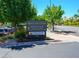 Desert Shores community sign advertising Lagoon Park with boats, open weekends 10AM to 4PM at 2736 Huber Heights Dr, Las Vegas, NV 89128