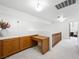 Well-lit hallway with a built-in desk and storage space, leading to other parts of the home at 2736 Huber Heights Dr, Las Vegas, NV 89128