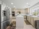 Open kitchen boasts stainless appliances, center island and plenty of counter space at 2736 Huber Heights Dr, Las Vegas, NV 89128