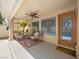 An inviting covered patio with comfortable seating and an outdoor ceiling fan at 2736 Huber Heights Dr, Las Vegas, NV 89128