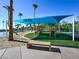Fun playground area with modern equipment, shade, and sandy beach at 2736 Huber Heights Dr, Las Vegas, NV 89128
