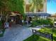 Charming restaurant entrance with lush greenery, outdoor seating, and a welcoming ambiance at 2736 Huber Heights Dr, Las Vegas, NV 89128